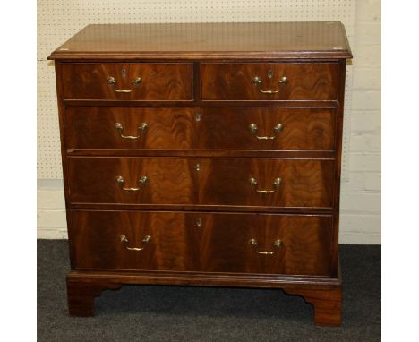 A 19th century mahogany chest, the rectangular top with a moulded edge over two short and three graduated long drawers with b