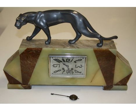 An Art Deco mantle clock, the onyx and marble case with spelter panther surmount enclosing a French eight day bell striking m