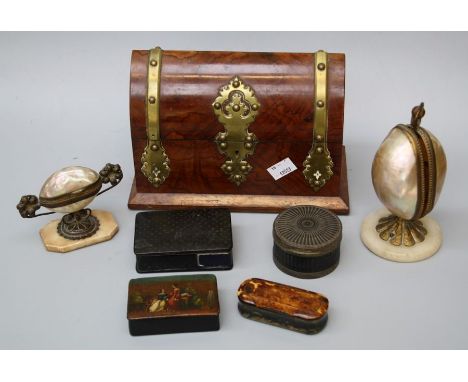 A Victorian walnut, brass bound scent bottle box of navette form with two associated bottles, two abalone shell mantle orname