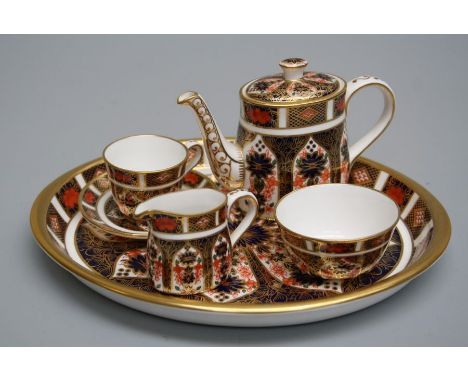 *** RE OFFER JULY £180-200 R 180***
A Royal Crown Derby miniature caberet tea service and tray, each decorated in the Imari p