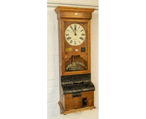 A good National Time Recorder Co Ltd wall-mounted industrial time recorder/clocking-in clock. Contained in an oak case with c