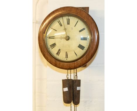 A Victorian postman alarm wall clock with two-train movement. Wood pillars on movement. Striking on a bell. 9-inch wooden dia