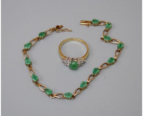 A bracelet set with emeralds in yellow metal, stamped 9k together with a jade and diamond ring, size Q, stamped 750. Gross we