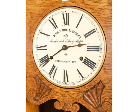 A rare Key Type Bundy USA Industrial time recorder clocking in clock. Fully restored with keys in a lovely oak case, 16" x 51