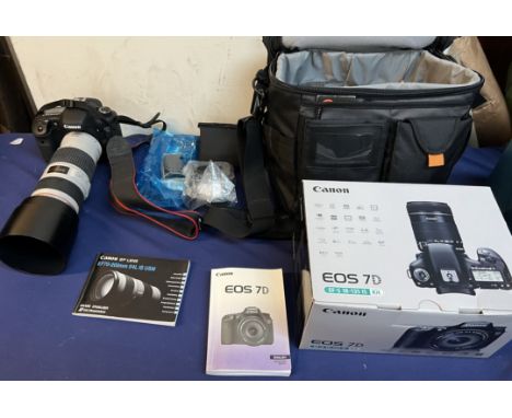 A Canon EOS 7D digital camera together with a Canon EF 70-200mm f/4L IS USM Lens, case etc 