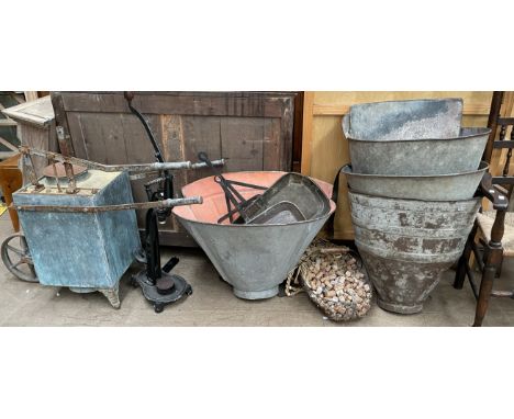 A French galvanised metal grape pickers hopper together with three other examples three shallow pans, a corking machine, a ba