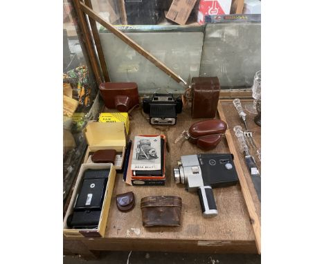 A Rolleicord camera together with other cameras and equipment