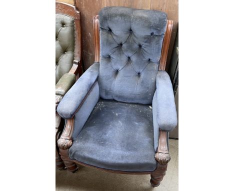 An early 19th century mahogany framed library chair with button back upholstery, pad arms and seat on leaf carved capped turn