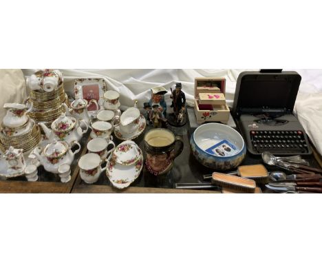 A Royal Albert Old Country Roses pattern part tea and dinner service together with a Royal Doulton character jug, dressing ta