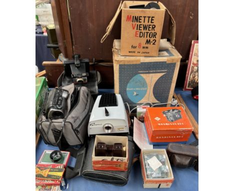 A Polaroid camera together with A canon video camera, Gnome junior classic, Bell &amp; Howell projector etc 