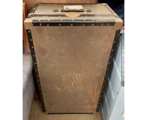 A white metal steamer trunk, 
