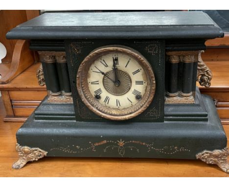An ebonised mantle clock, the dial with Roman numerals