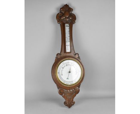 A Late Victorian/Edwardian Carved Oak Onion Topped Wheel Barometer with Thermometer 