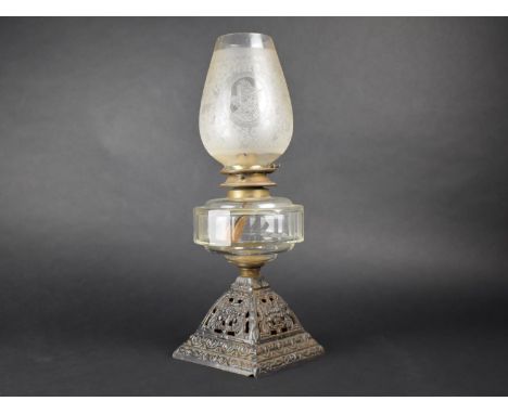 A Victorian Oil Lamp with Pierced Cast Iron Base, Glass Reservoir and Etched Glass Shade, 46cms High 