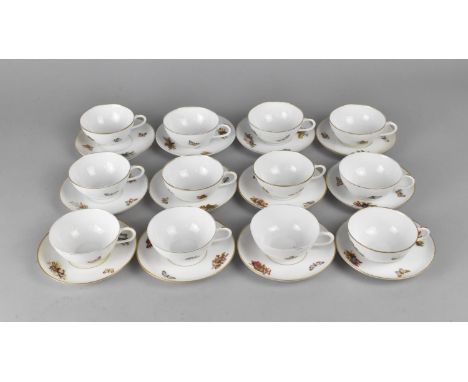 A Continental Porcelain Set of Twelve Cups and Saucers Decorated with Cherubs, Butterflies etc (Some Condition Issues) 