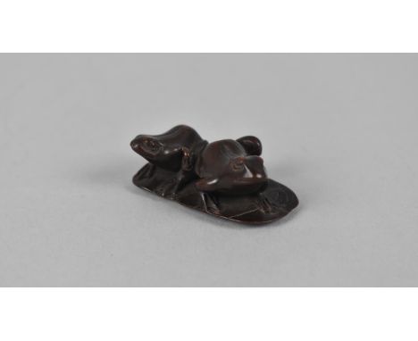 A Carved Wooden Netsuke Depicting Two Frogs on Lilypad, Signed to Base, 4.5cms Wide 