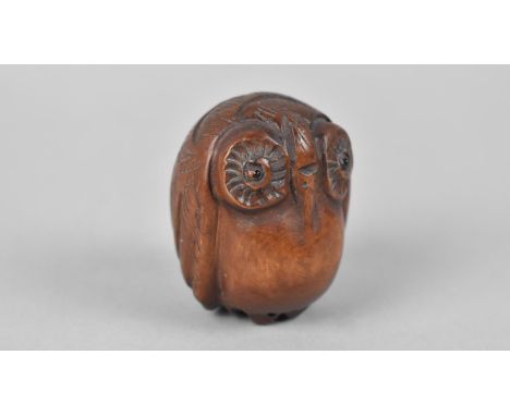 A Carved Wooden Netsuke in the Form of an Owl 