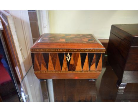 An early 19th century mahogany and parquetry tea caddy, width including handles 24.5cm, with key. 