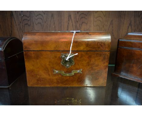 A Victorian walnut and brass mounted tea caddy, 22.5cm wide, with key. 