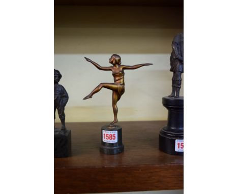 An Art Deco gilt bronze figure of a dancing lady, 14cm high, on green marble socle. 