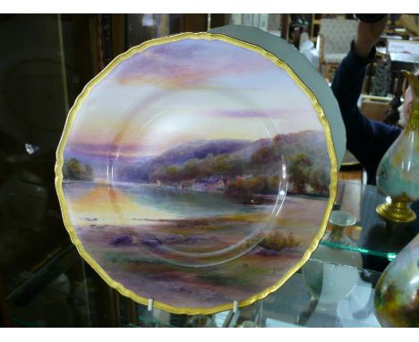 A Royal Worcester cabinet plate, circa 1926, painted with the River Dart by Harry Davis, 27cm diameter.  Condition Report: No