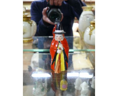 A Royal Worcester candle snuffer figure of 'The Witch', circa 1917, No.2543, 9cm high.