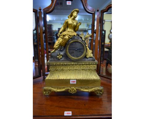 A late 19th century, Louis XVI style, gilt metal mantel clock, with figural surmount and bell strike, 48cm high. 