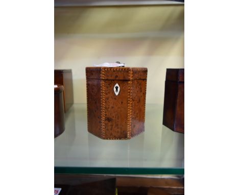A George III burr yew and chevron strung octagonal tea caddy, 10.5cm wide, with original key. 