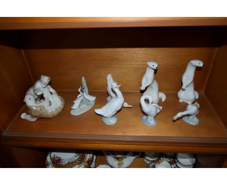 A collection of Lladro, Nao and USSR figures.