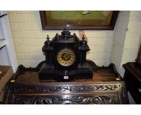 A large slate architectural mantel clock, 42cm wide. 