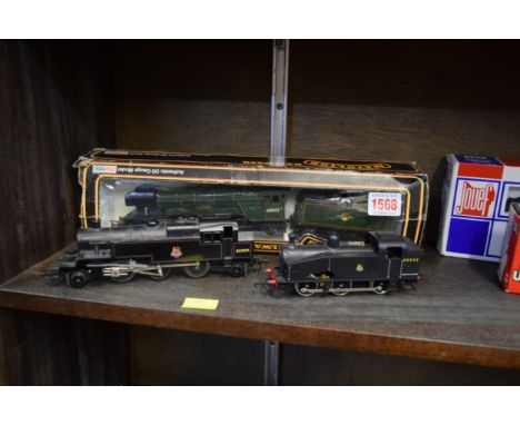 A Mainline Railways OO gauge locomotive and tender, boxed; together with another Triang OO gauge locomotive; and a Lima examp