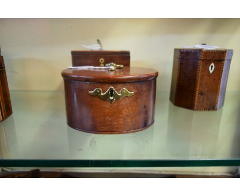 A George III mahogany oval tea caddy, stamped S Sharp, 15cm wide.