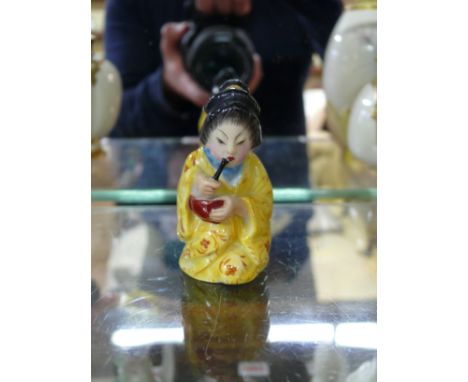 A Royal Worcester candle snuffer figure of 'Chinese Girl', circa 1924, 7.5cm high.