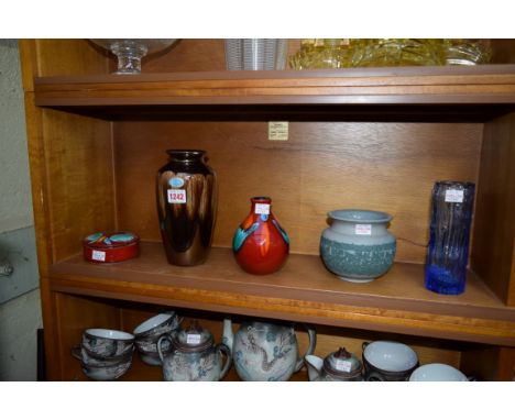 Four pieces of Poole pottery; together with a Whitefriars style glass vase. 