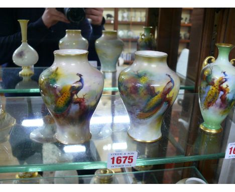 A pair of Royal Worcester vases, circa 1912, each painted with a peacock, one signed by F J Bray, the other by A Watkins, 10.
