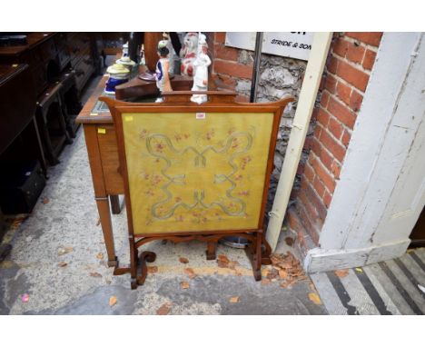 An early 20th cenury mahogany framed silk embroidered firescreen, 69cm wide. 