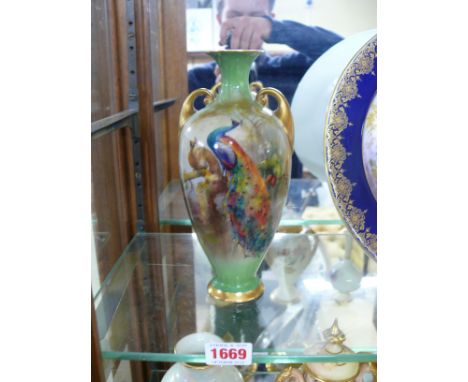 A Royal Worcester twin handled vase, circa 1913, painted with peacocks, by Sedgley, 20cm high.  Condition Report: No visible 