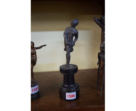 A bronze figure of a Roman centurion, 14.5cm high, on ebonized socle. 