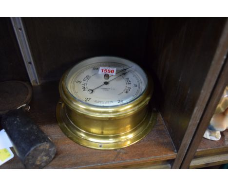 A Sestrel brass bulkhead barometer, 20.5cm diameter. 