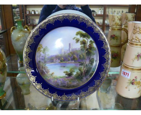 A Royal Worcester cabinet plate, circa 1906, painted with Durham Cathedral, by Harry Davis, 25.5cm diameter.  Condition Repor
