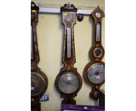 A 19th century rosewood and mother of pearl three dial wheel barometer, by W Ward, Watchmaker, Gt Grimsby.