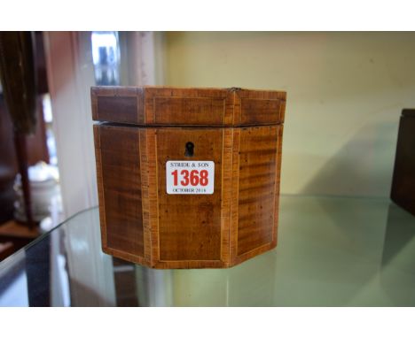 A George III fiddle back mahogany and tulipwood crossbanded octagonal tea caddy, 14cm wide. 