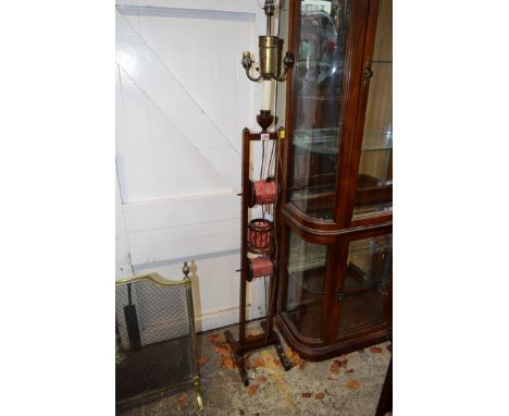 An unusual mahogany standard lamp, incorporating adjustable wool winders. 