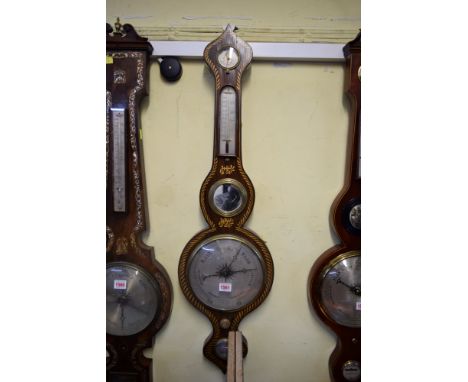A 19th century rosewood and parcel gilt five dial wheel barometer.