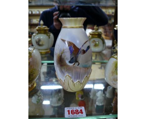 A Royal Worcester vase, circa 1903, painted with a mallard in flight, by James Stinton, 13.5cm high. 