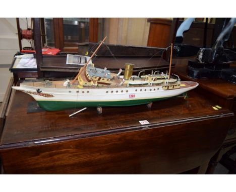 An old painted wood model of a vintage steam yacht, 76.5cm long.  Condition Report: No signs of an engine of any description.