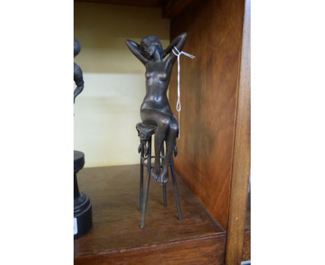 After Chiparus, a bronze seated female nude, 25.5cm high.