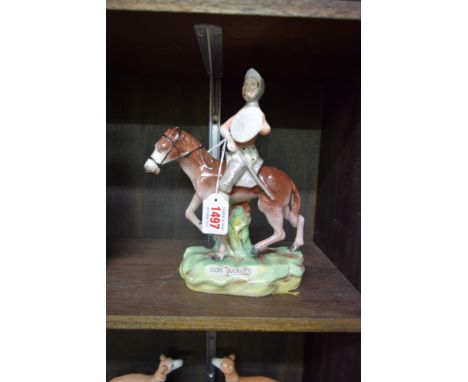 A Victorian Staffordshire pottery group of Don Quixote, 24cm high.  Condition Report: Paint loss to pony and crazing to glaze