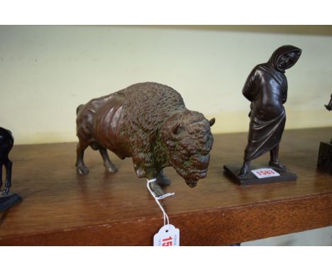 A bronze model of a bison, 20cm long. 