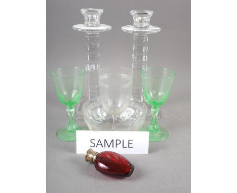 A ruby glass and silver gilt topped scent bottle, 3 1/4" high, four uranium glass goblets, a pair of candlesticks and other g